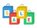 Set of shopping bags with letters of sale word on them.