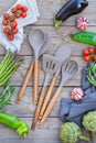 Set of silicone kitchen utensils on a wooden table