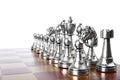 Set of silver chess pieces on wooden board against white background Royalty Free Stock Photo