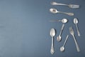 Set of silver cutlery on grey background, flat lay Royalty Free Stock Photo