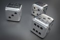 Set of silver dice with black dots isolated on black background Royalty Free Stock Photo