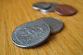 Set of silver Quarter Dollar coins currency in the USA, American Dollar on the wooden background