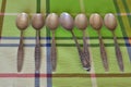 A set of silver teaspoons with a spoon from another set.