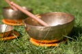 Set of singing bowls in the own garden, zen outdoors
