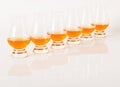 Set of single malt tasting glasses, single malt whisky in a glasses, white background Royalty Free Stock Photo