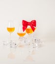 Set of single malt tasting glasses, single malt whisky in a glasses, white background, red bow Royalty Free Stock Photo