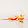 Set of single malt tasting glasses, single malt whisky in a glasses, white background, red bow Royalty Free Stock Photo