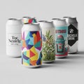 A set of six beverage cans, each with a distinct design. The first can has a minimalist Royalty Free Stock Photo