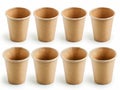 A set of six brown paper cups on a white background Royalty Free Stock Photo