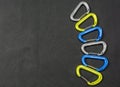 Colored carabiners for climbing with wire gate.