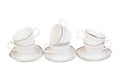 Set of six cups for tea or coffee on saucers, isolated on white background. Royalty Free Stock Photo