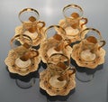 Set of six empty tulip-shaped cups of tea