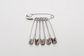 Set of safety pins on white background Royalty Free Stock Photo