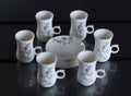 Set of six porcelain cups of coffee Royalty Free Stock Photo