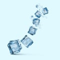 Ice cubes with water splashes isolated on blue background Royalty Free Stock Photo