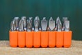 Set of metal bits for a screwdriver in an orange plastic box on the table Royalty Free Stock Photo