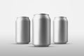 Set of small tin cans with an alcoholic drink with drops of water, a mockup standing in the background for advertising