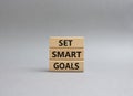 Set smart goals symbol. Concept words Set smart goals on wooden blocks. Beautiful grey background. Business and Set smart goals Royalty Free Stock Photo