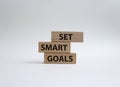 Set smart goals symbol. Concept words Set smart goals on wooden blocks. Beautiful white background. Business and Set smart goals Royalty Free Stock Photo