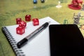 Set of smartphone, notebook and mechanical pencil to play dices on the role play dungeons and dragons Royalty Free Stock Photo