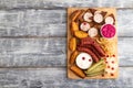 set of snacks: sausages, toast, sauerkraut, marinated onion and cucumber, baked potato. Top view, copy space