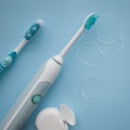 A set of sonic toothbrush, dental floss and classic toothbrush Royalty Free Stock Photo