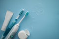 A set of sonic toothbrush, dental floss and toothpaste. Royalty Free Stock Photo