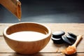 A set for spa procedures, massage stones, bath salts and flavored water, collected from a bamboo stem into a bowl Royalty Free Stock Photo