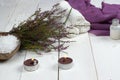 Set for spa treatments and heather branch lie on a white wooden table Royalty Free Stock Photo