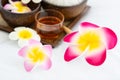 Set of spa treatments, natural oil, and plumeria flowers