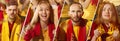 Spanish emotive football, soccer fans cheering their team with a red scarfs at stadium. Concept of sport, emotions, team Royalty Free Stock Photo