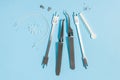 A set of special tools for an orthodontist to install braces for a patient. Orthodontic arcs, ligature, locks, positioner,