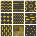 Set of spectacular patterns with gold hand drawn elements on black background.