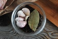 Set of spices in glass bowl - garlic, pepper, Bay leaf Royalty Free Stock Photo