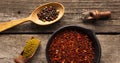 A set of spices and herbs. Indian cuisine. Pepper, salt, paprika, basil, turmeric. On a black wooden background. Top view Royalty Free Stock Photo