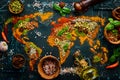 Set of spices and herbs. Indian cuisine. World map: Pepper, salt, paprika, basil, turmeric. On a black wooden board. Royalty Free Stock Photo