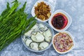 set of spicy fresh oyster salad Thai style , fresh oyster, spicy sauce, deep fried onion and fresh vegetable White popinac on ice Royalty Free Stock Photo