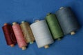 Set of spools of colored thread lie on a table Royalty Free Stock Photo