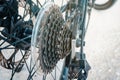 Set of sprockets on the rear wheel of a bicycle. The undercarriage of the bicycle