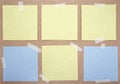 Set of square paper notes with sticky tape. Collection of yellow and blue paper sheets on kraft paper background. Mockup for desig Royalty Free Stock Photo