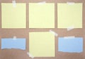 Set of square and torn paper notes with sticky tape. Collection of yellow and blue paper sheets on kraft paper background. Mockup Royalty Free Stock Photo
