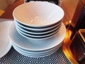 Set of Stacked White Bowls on Table Royalty Free Stock Photo