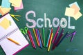 Set of stationery and word SCHOOL written on chalkboard Royalty Free Stock Photo