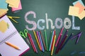 Set of stationery and word SCHOOL written on chalkboard Royalty Free Stock Photo