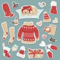 Set of stickers with cozy winter clothes and items.