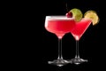 Set of strawberry daiquiri garnished with slice of lime on a black background. Classic Hemingway cocktail Royalty Free Stock Photo