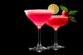 Set of strawberry daiquiri garnished with slice of lime on a black background. Classic Hemingway cocktail Royalty Free Stock Photo