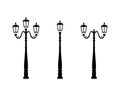 Set of street lights silhouettes. Black and white illustration, white isolated background. Royalty Free Stock Photo