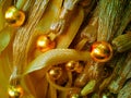 A set of strings of yellow ribbons decorated with round beads