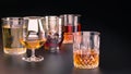 A set of strong alcoholic beverages in glasses, in the presence of whiskey, vodka, rum, brandy, tequila, on a dark background Royalty Free Stock Photo